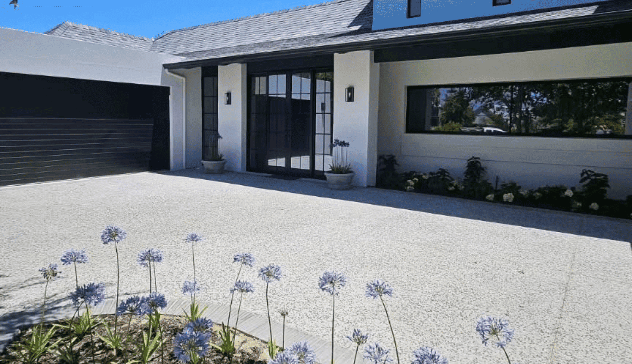 Black aluminium windows installed on modern residential property